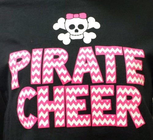 pink and white discharge print on a black shirt