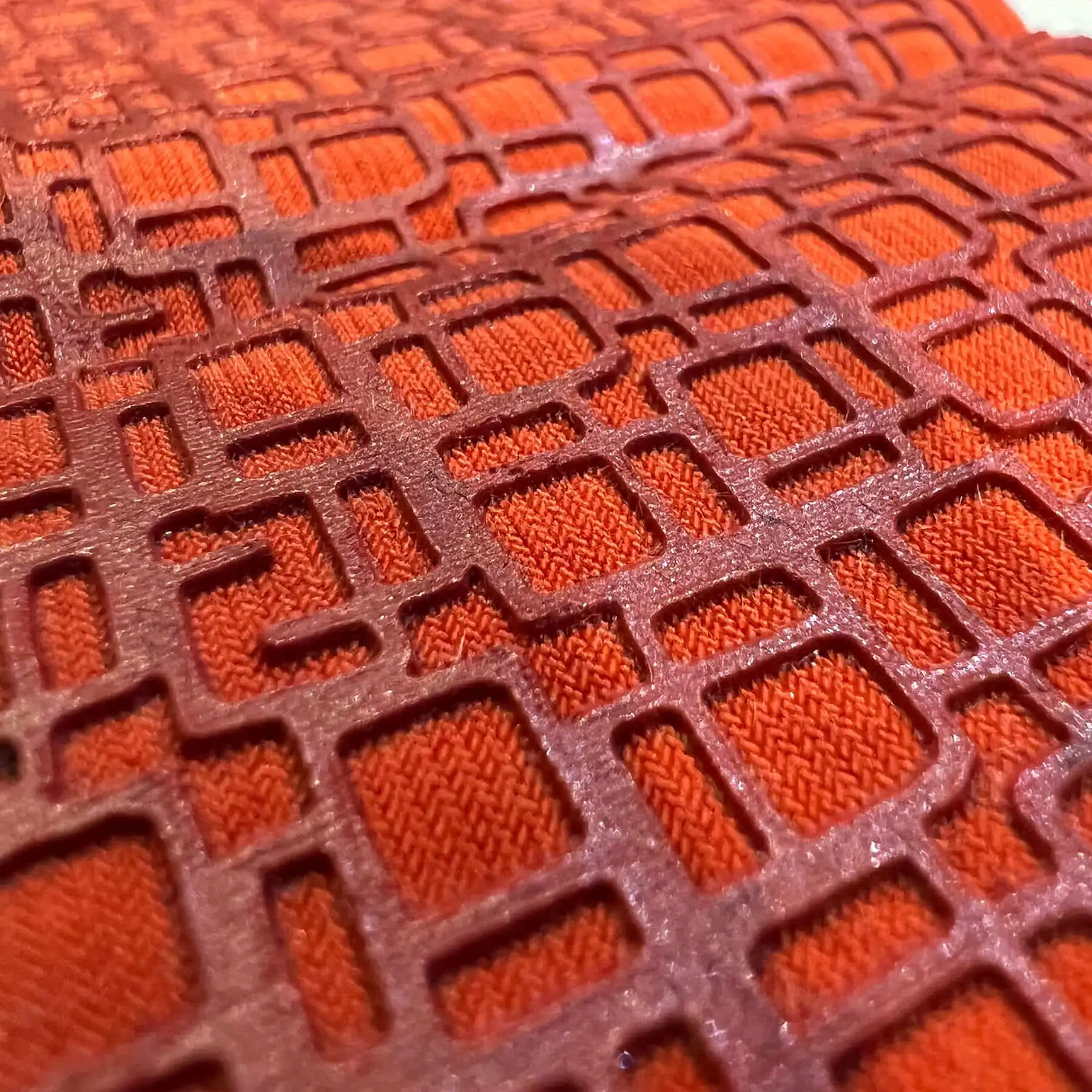 tonal raised high-density grid on an orange shirt
