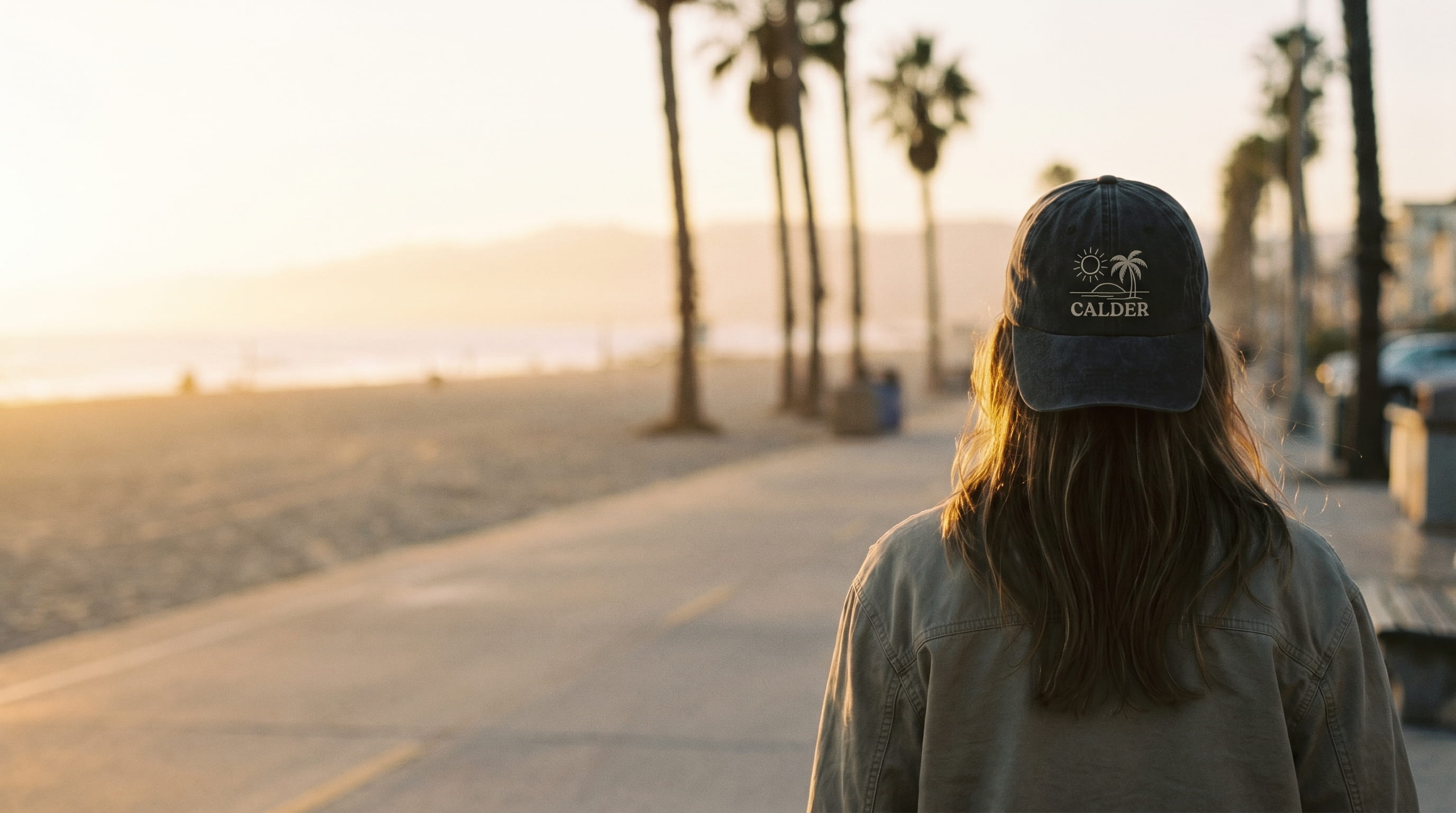 Person wearing a decorated pigment-washed Adams Headwear dad cap