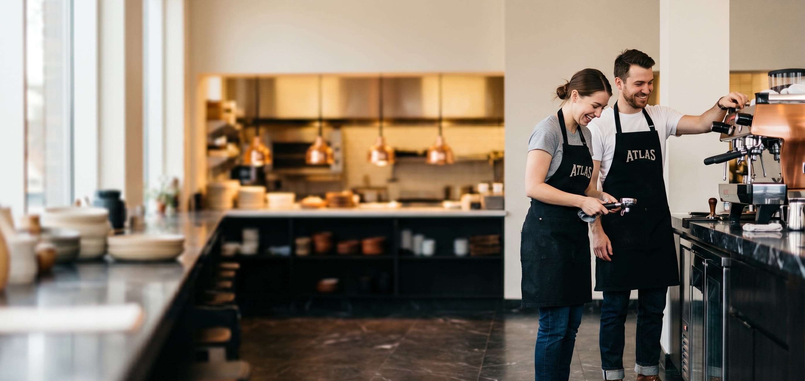 Barista wearing a decorated black canvas custom apron
