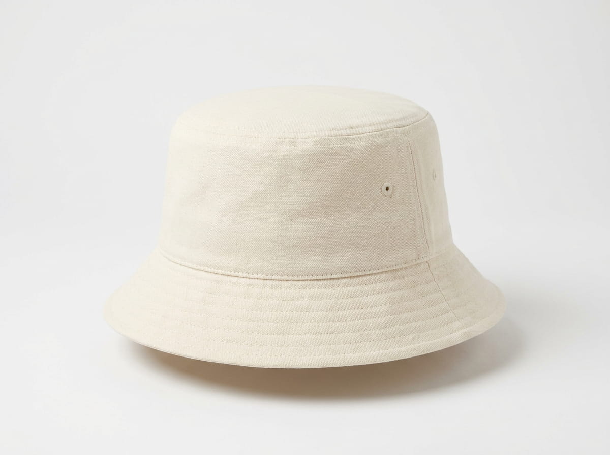 Atlantis bucket hat anatomy — three-quarter view showing crown, brim, and eyelet