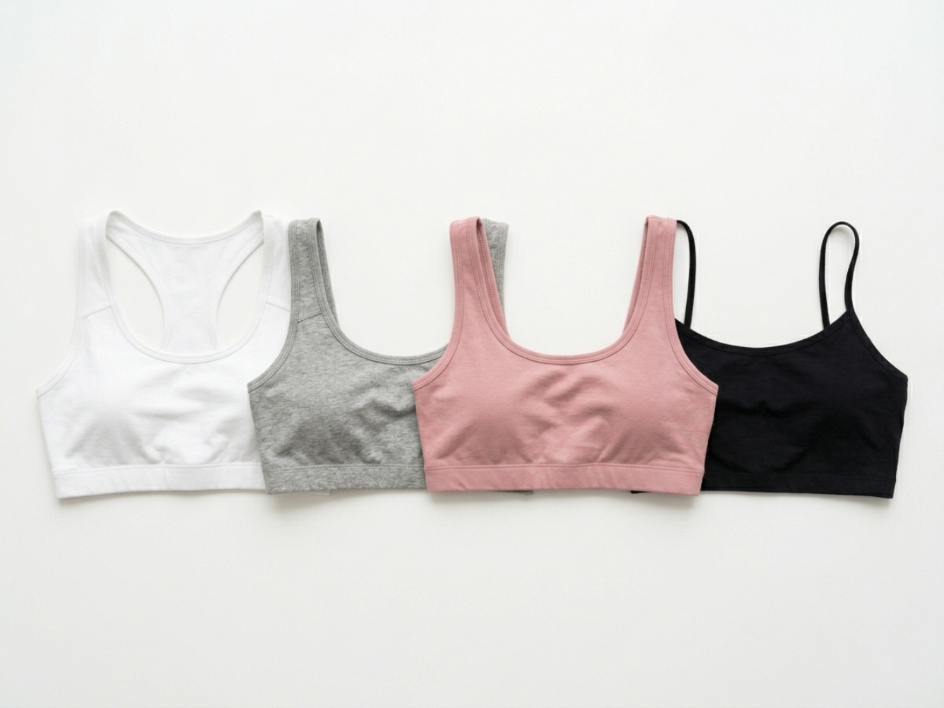 Collection of custom women's bralettes in various styles and colors