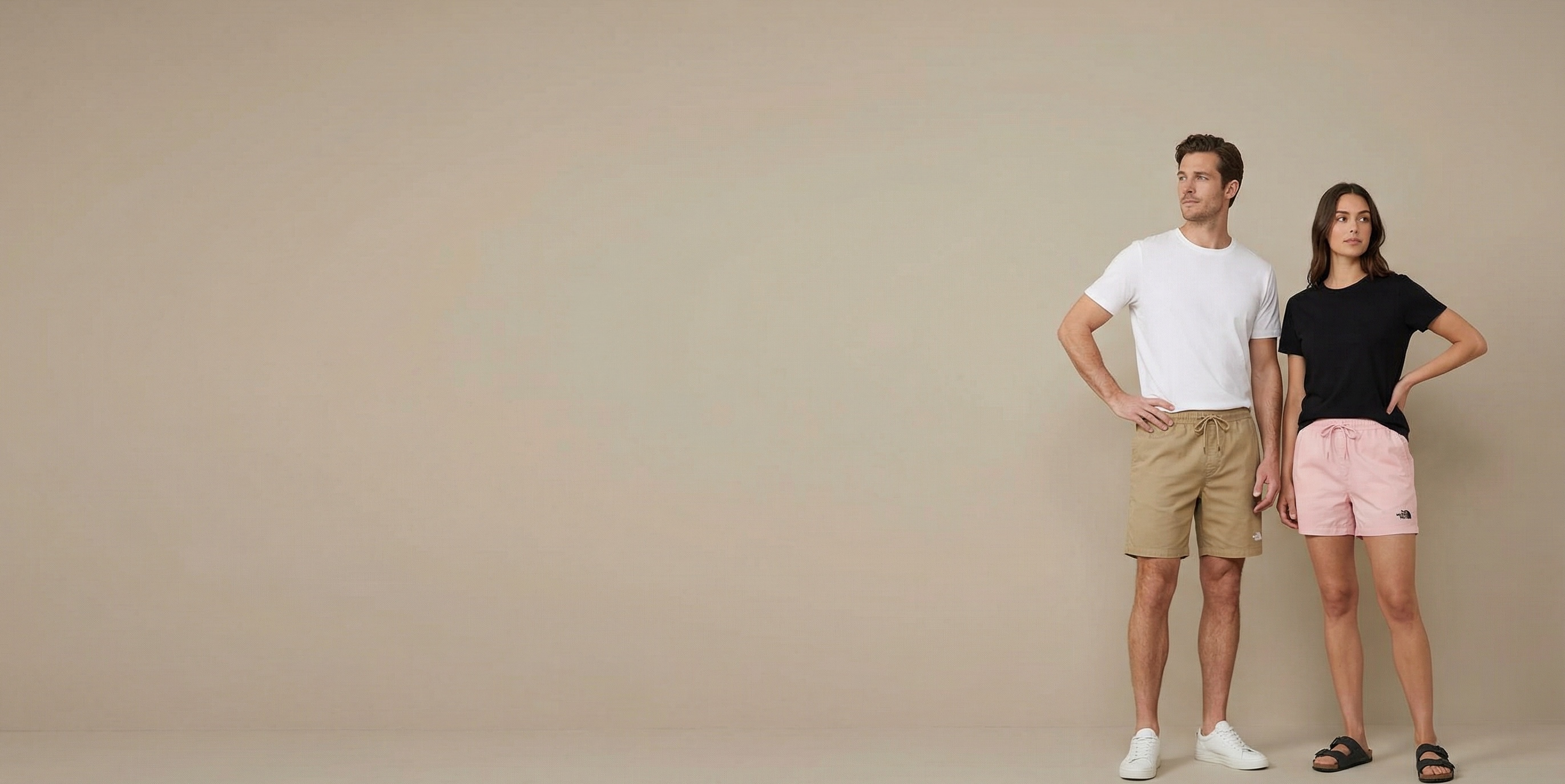 Man and woman wearing custom decorated casual shorts