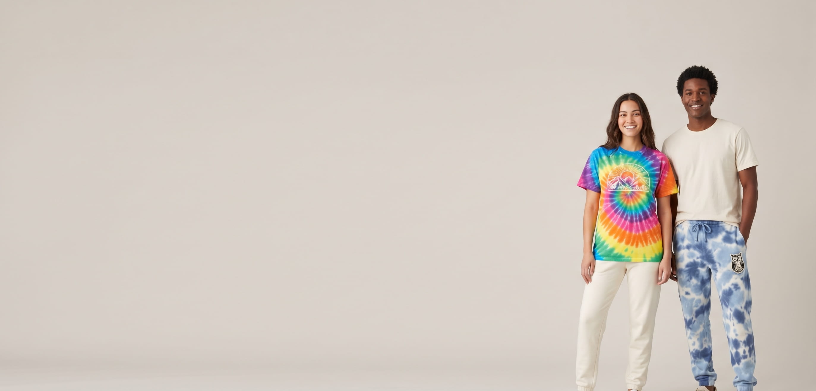 Two models with decorated Colortone tie-dye apparel in a clean studio