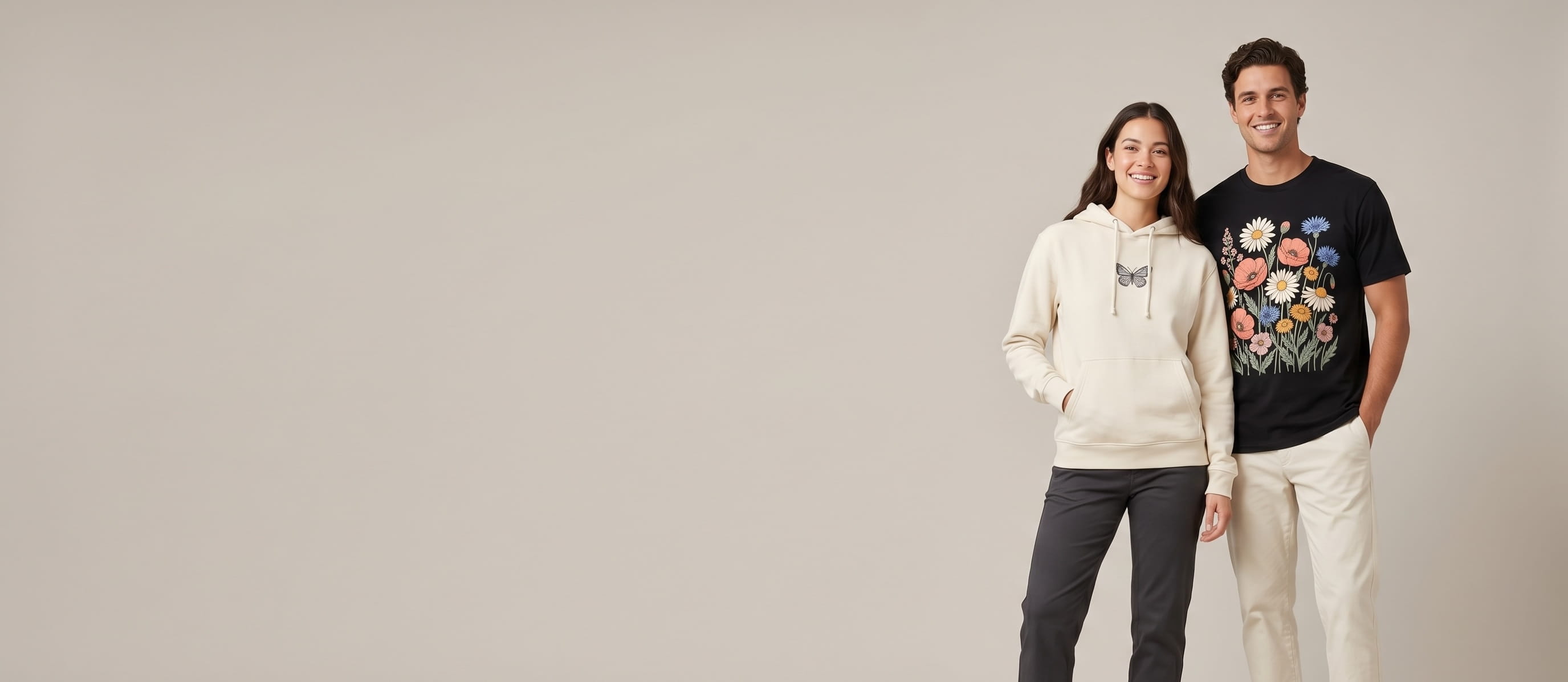 Two models with decorated Everywhere Apparel recycled-cotton apparel in a clean studio