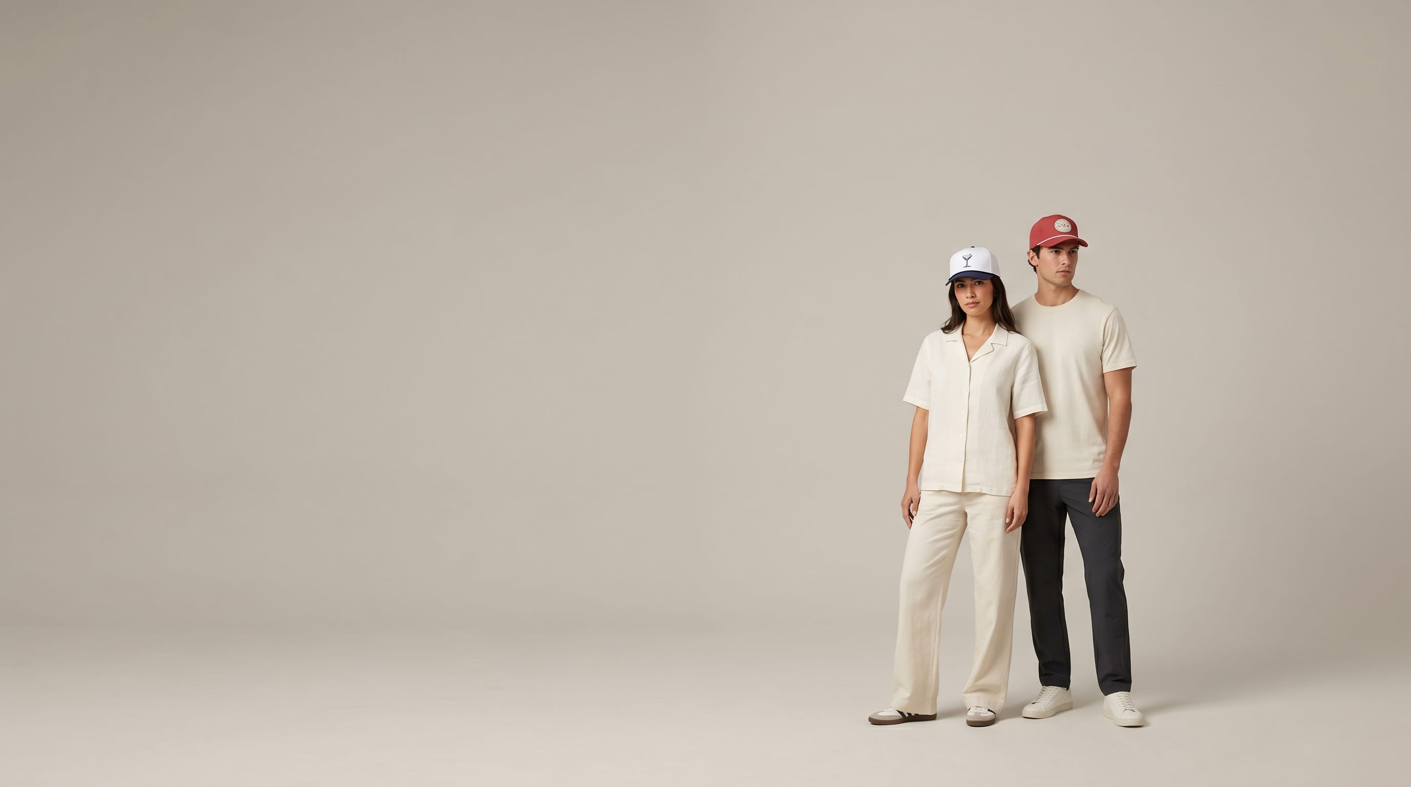 Two models with decorated Imperial heritage caps in a clean studio
