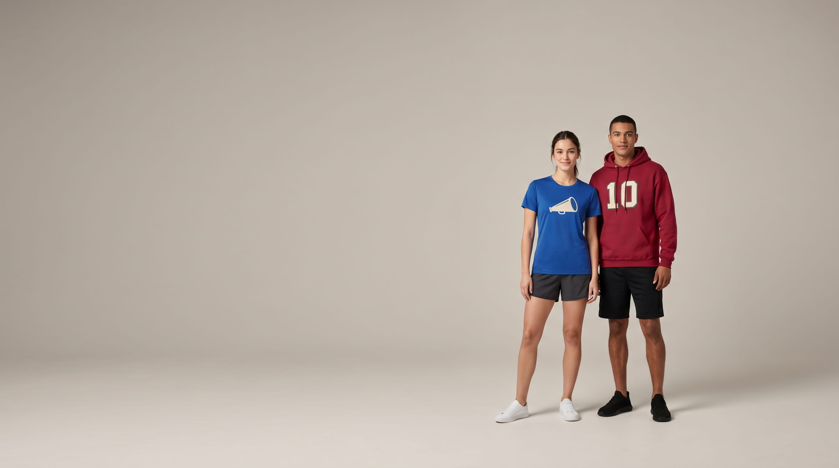 Two models with decorated Jerzees value blank apparel in a clean studio