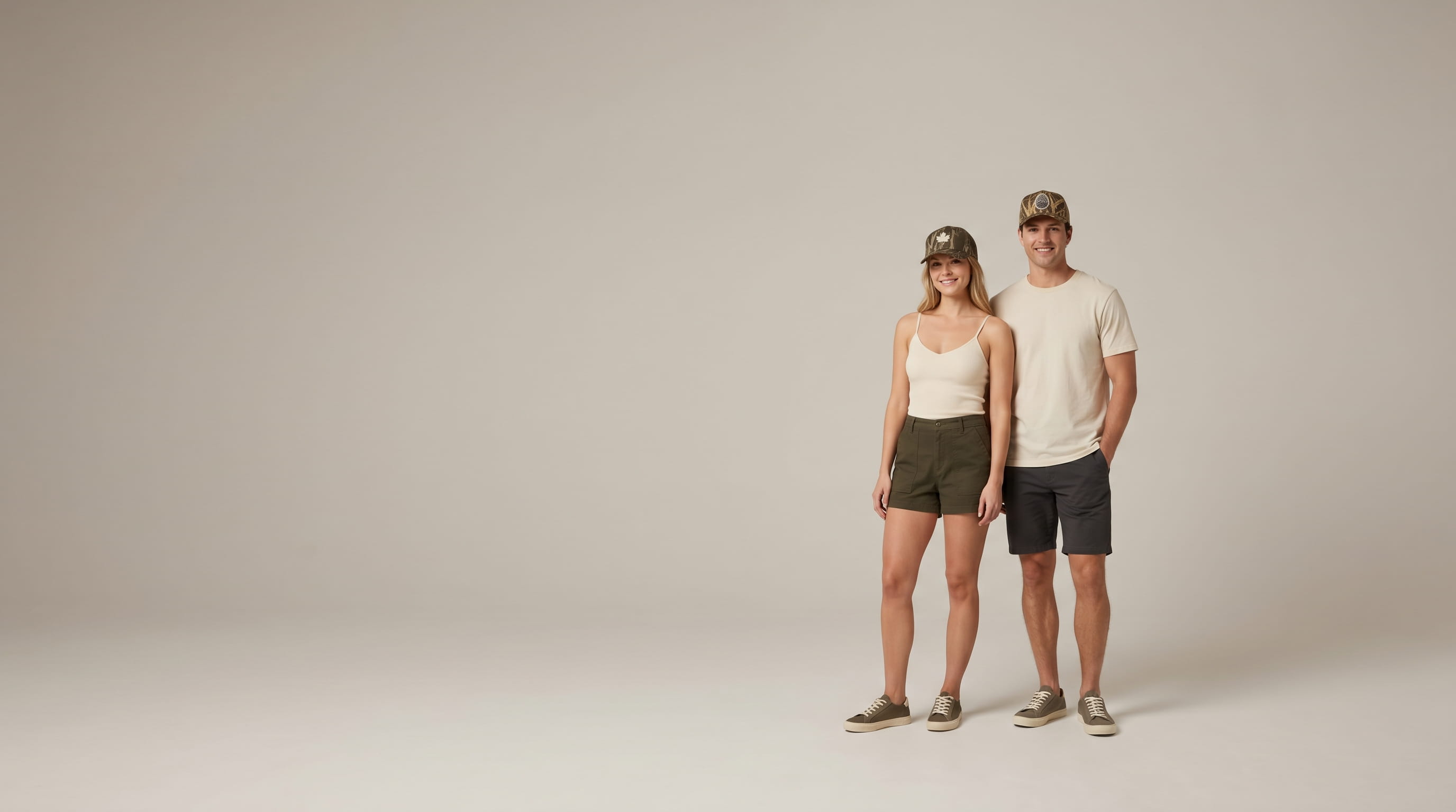 Two models with decorated Kati heritage licensed-camo caps in a clean studio