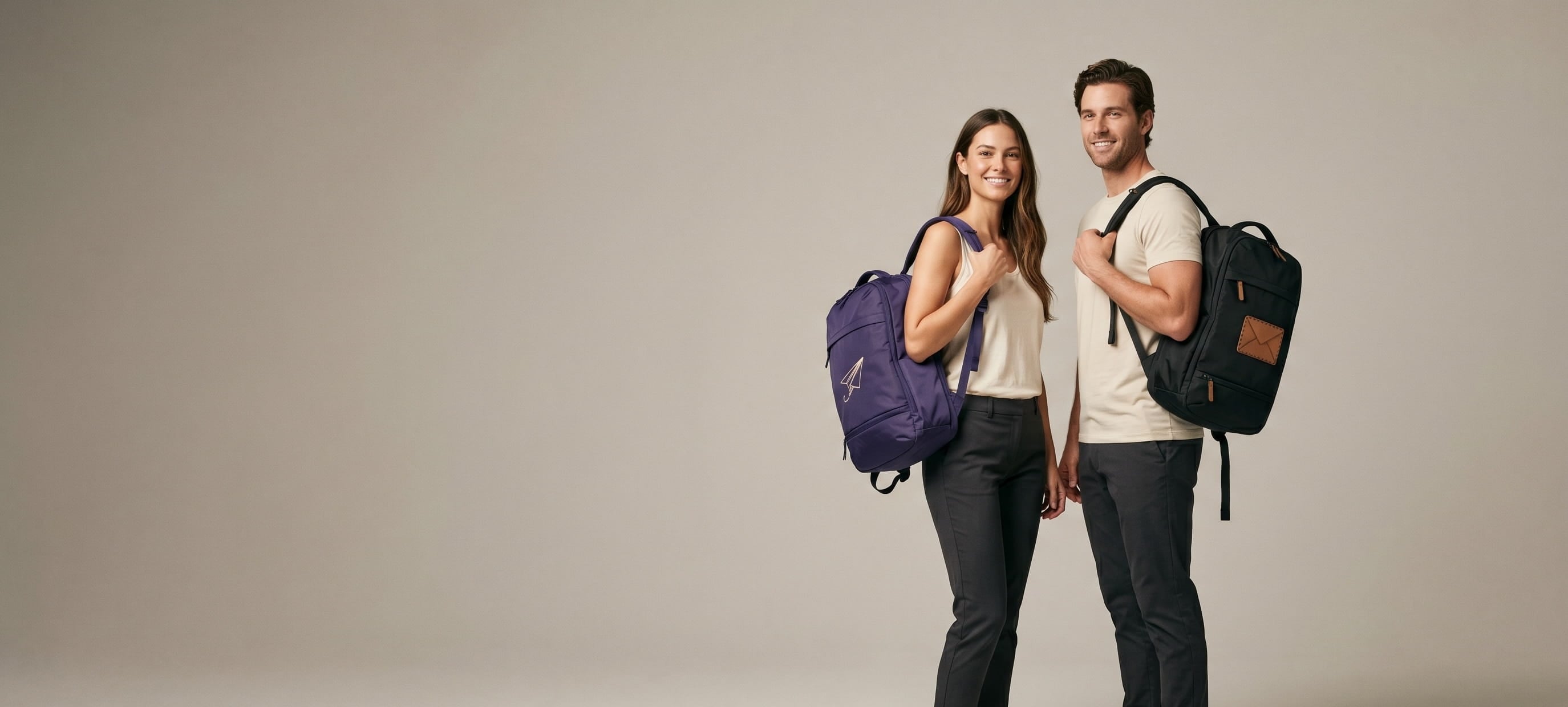 Two models with decorated Knack premium expandable travel bags in a clean studio