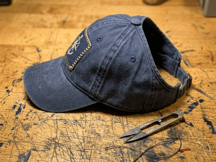 Custom patch on ponytail hat front panel