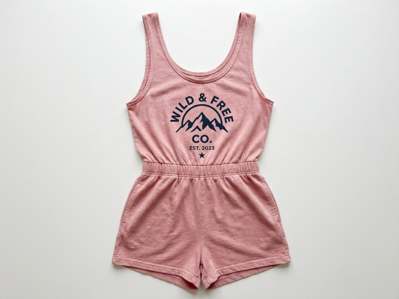 Screen-printed women's romper showing bold ink on garment-dyed cotton
