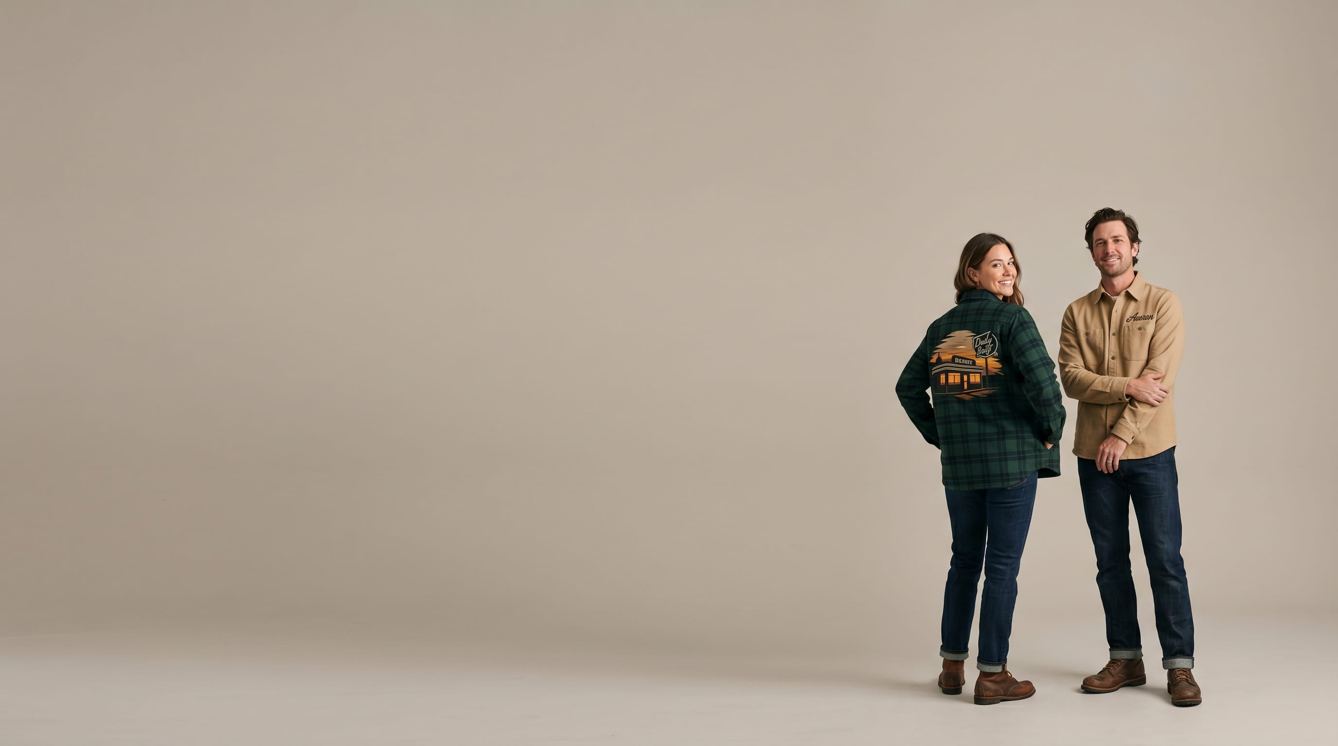Two models wearing decorated heavyweight shirt-jackets in a clean studio lookbook shot