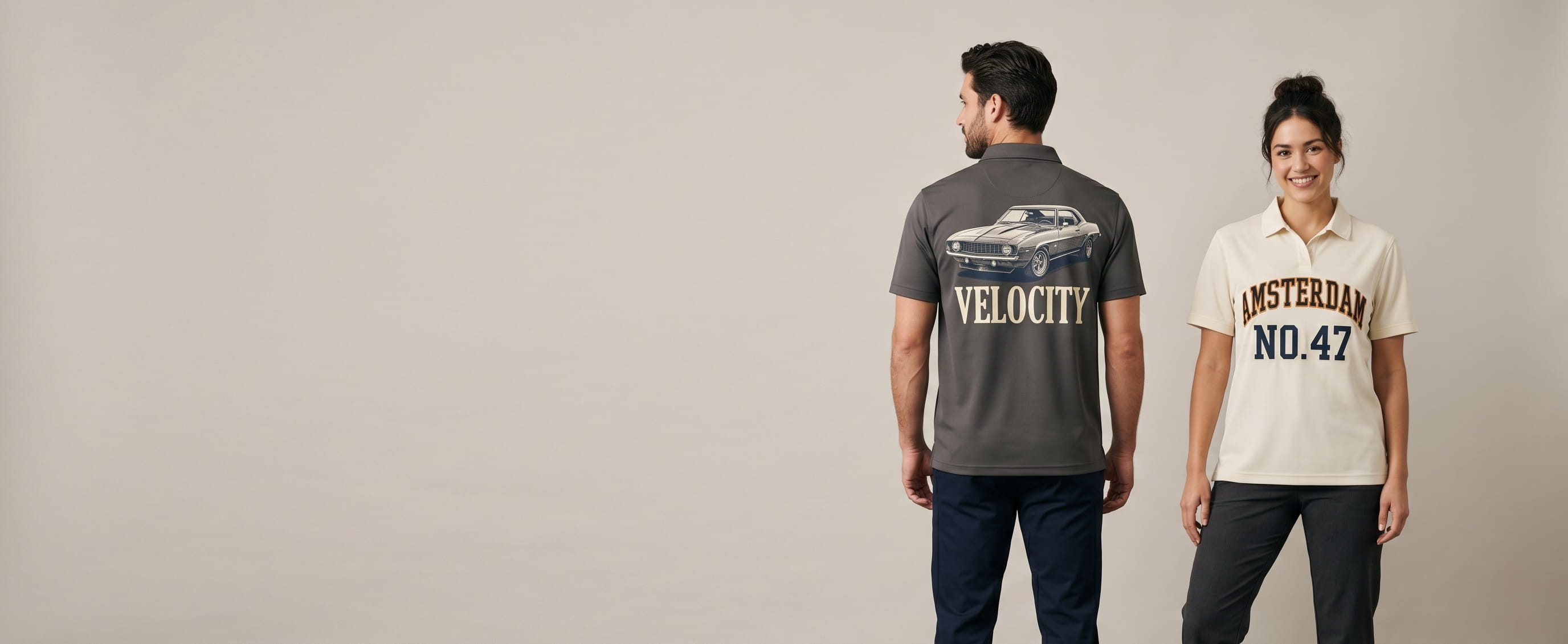Two lifestyle models in custom performance shirts — one in a heritage anthracite performance polyester pique polo with a full-back vintage muscle-car + "VELOCITY" magazine typography screen print, one in a heritage cream body-fit performance pique polo with a full-front "AMSTERDAM / NO. 47" heritage college-varsity arched flat embroidery