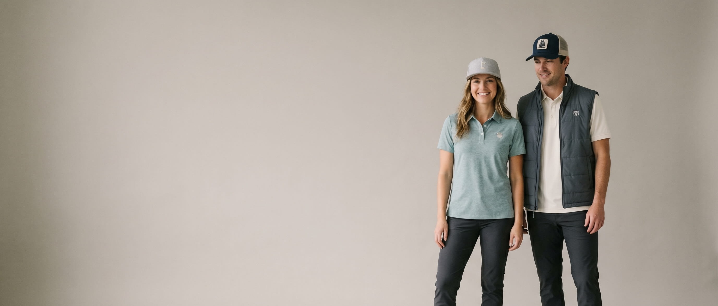 Two models with decorated Linksoul SoCal golf-and-lifestyle apparel in a clean studio