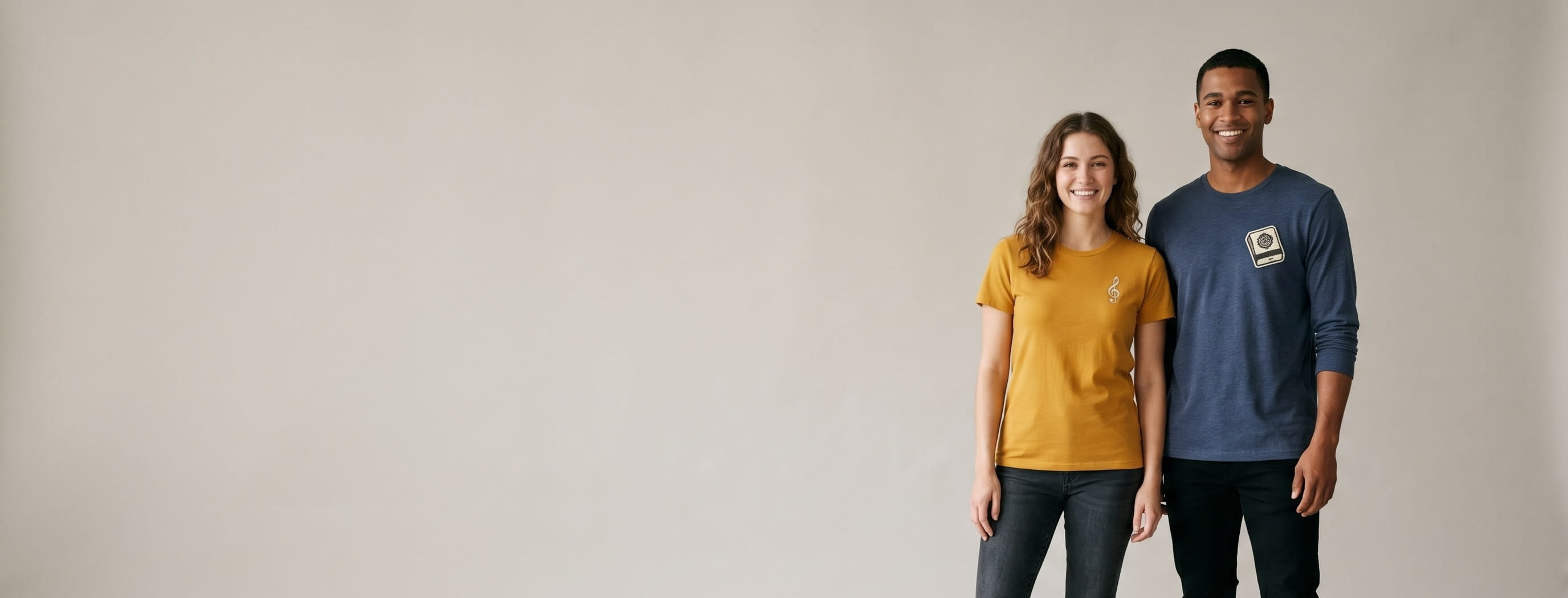 Two models with decorated M&O soft-hand cotton tees in a clean studio