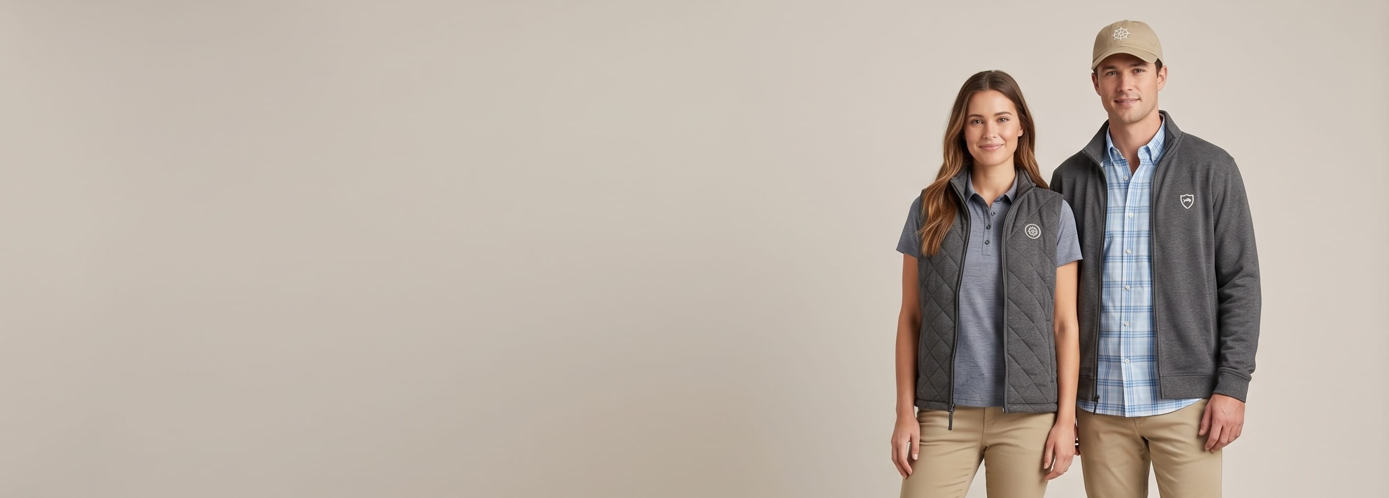 Two models layered with multiple decorated Southern Tide premium coastal-lifestyle products in a clean studio