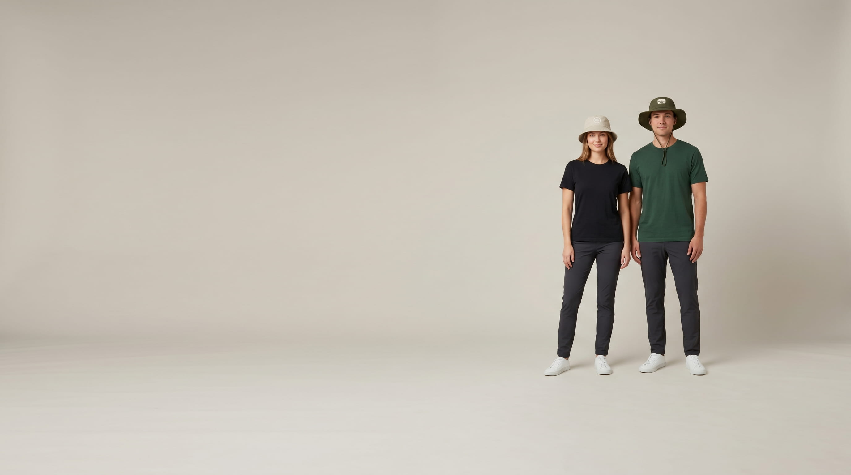 Two models with decorated The Game Newport Bucket Cap and Ultralight UPF Booney in a clean studio