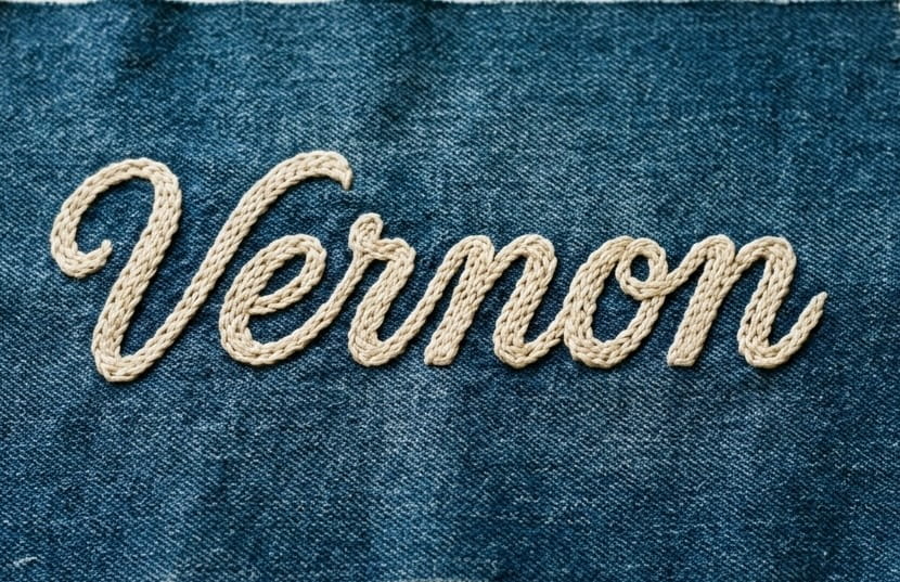 Looped vintage chain stitch script on denim