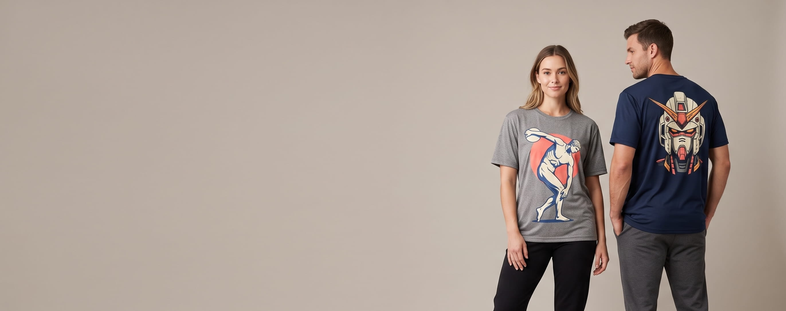 Two athletic lifestyle models — woman in a heather-grey moisture-wicking performance crew with a full-chest team mark, man in a navy performance polo with an embroidered chest crest