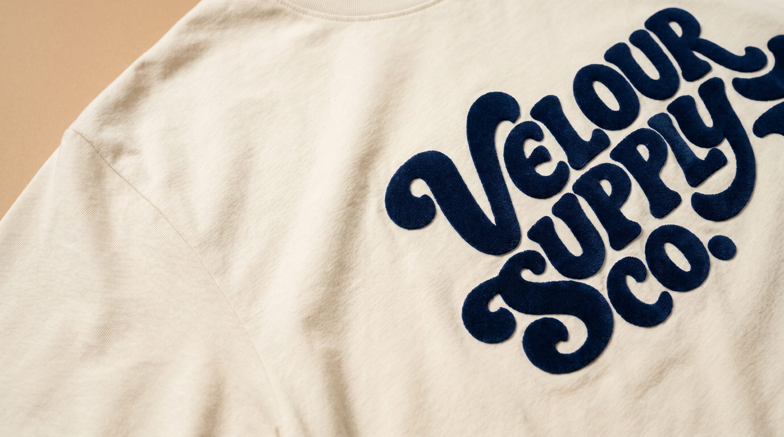 Plush velvet flocking screen prints on a t-shirt, hoodie, and sweatpants
