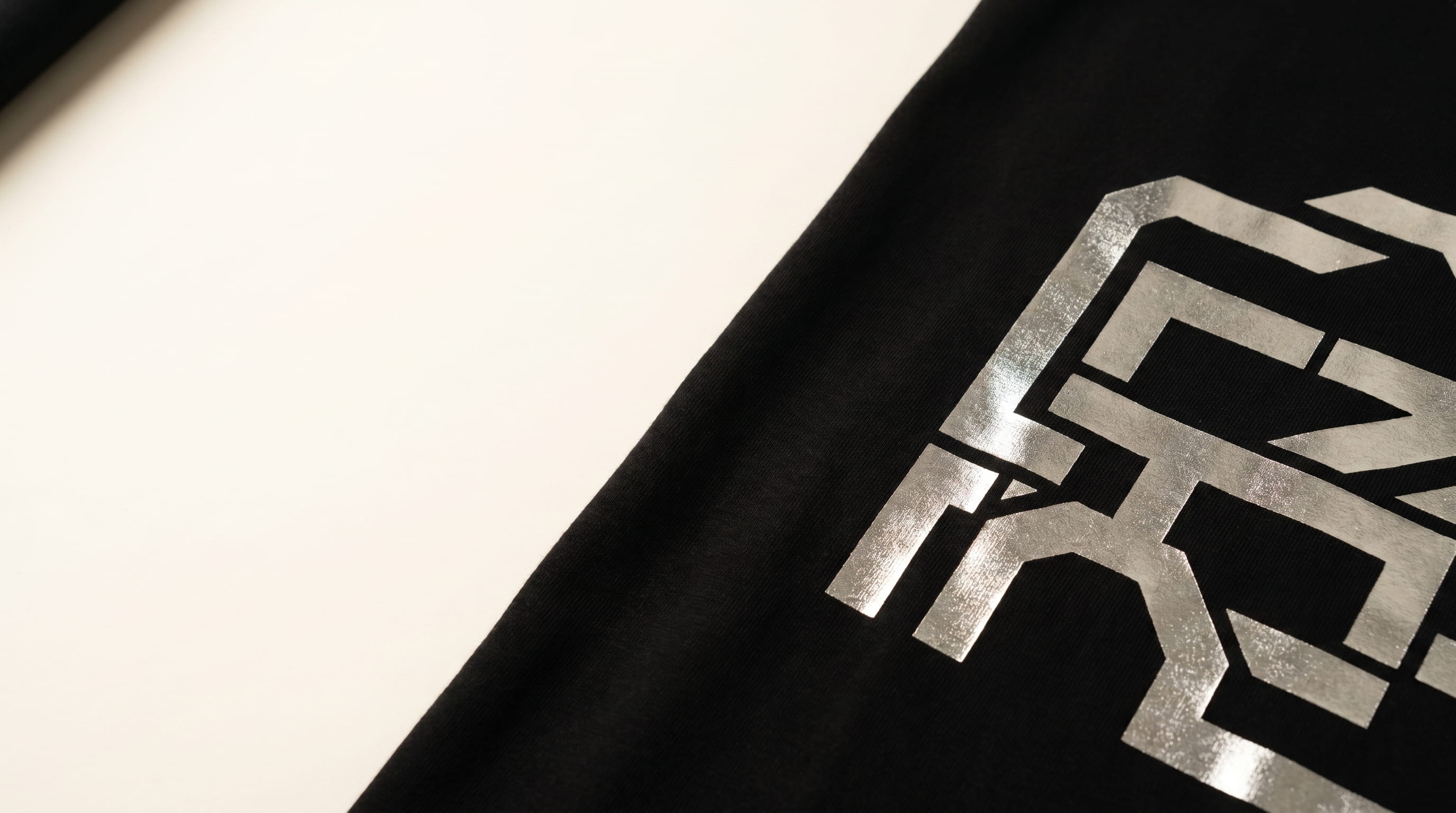 Metallic gold foil screen print on a t-shirt