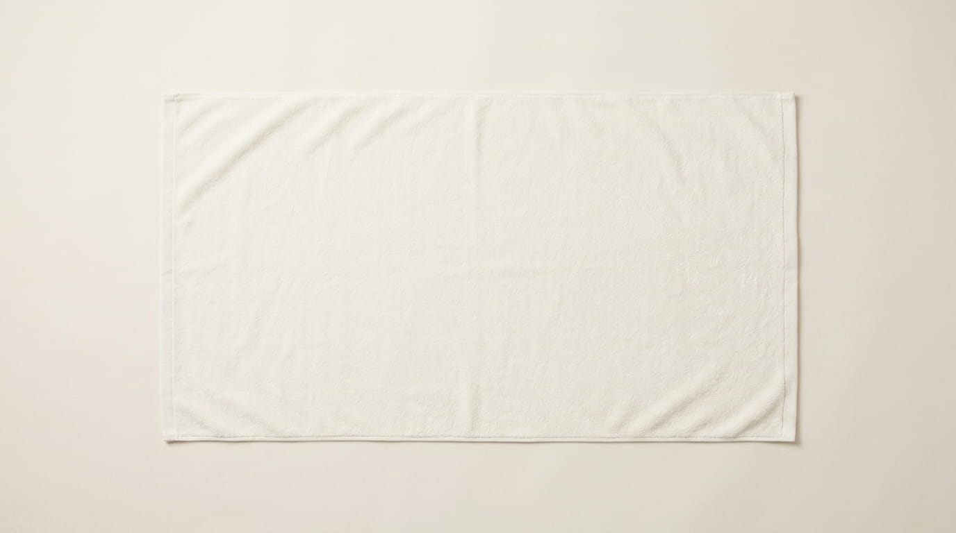 Custom towel anatomy — velour terry-cloth face, center face decoration canvas, corner accent zone, and hemmed-edge construction