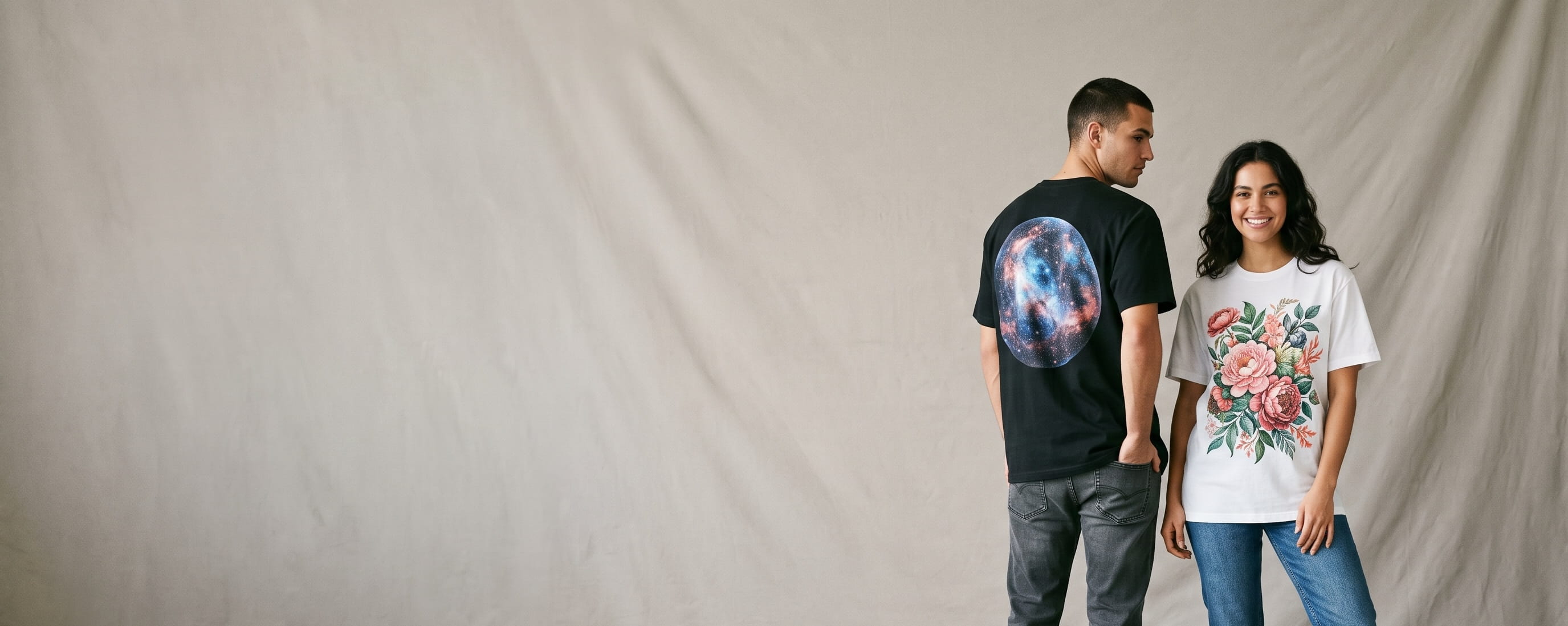 Two casual lifestyle models — woman in a white ringspun cotton crewneck with a full-chest full-color photographic DTG print, man in a black heavyweight cotton crewneck with a full-chest illustrated DTG print with smooth gradients
