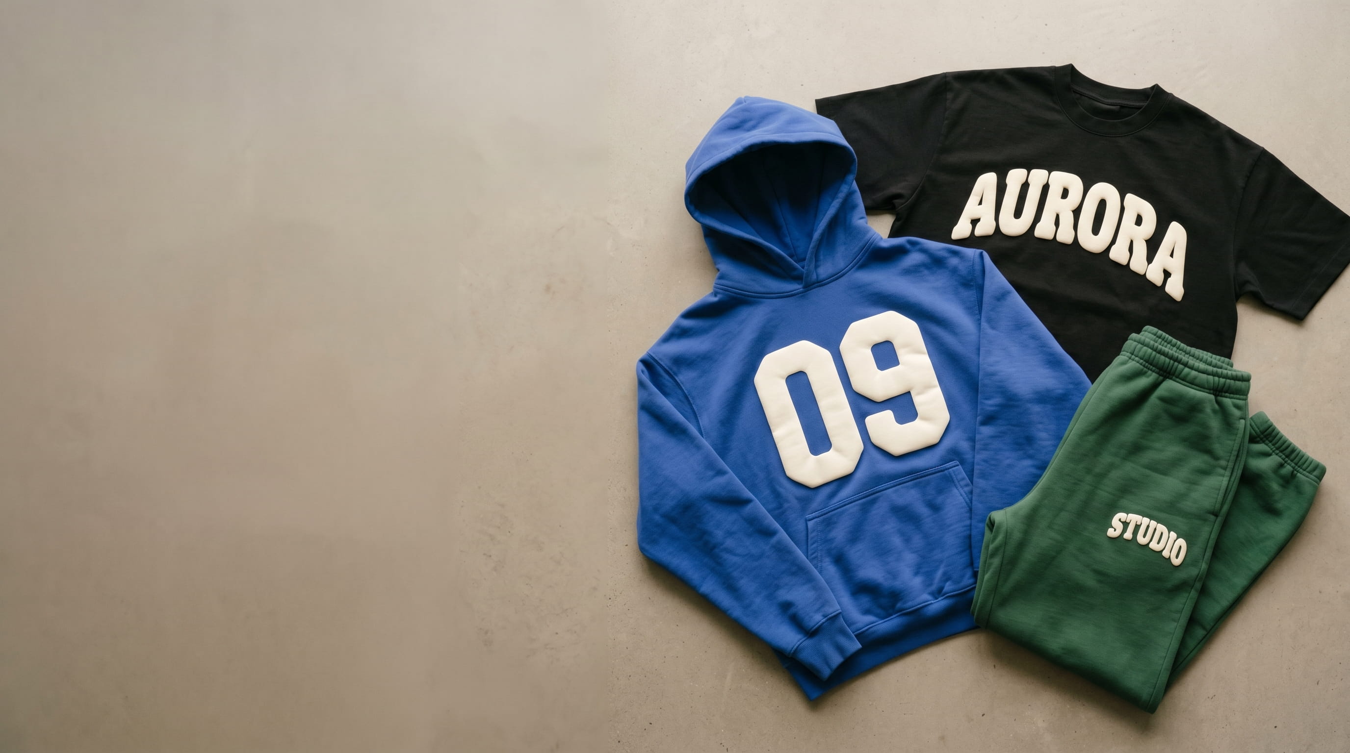 Bold raised 3D puff screen print on a t-shirt, hoodie, and sweatpants