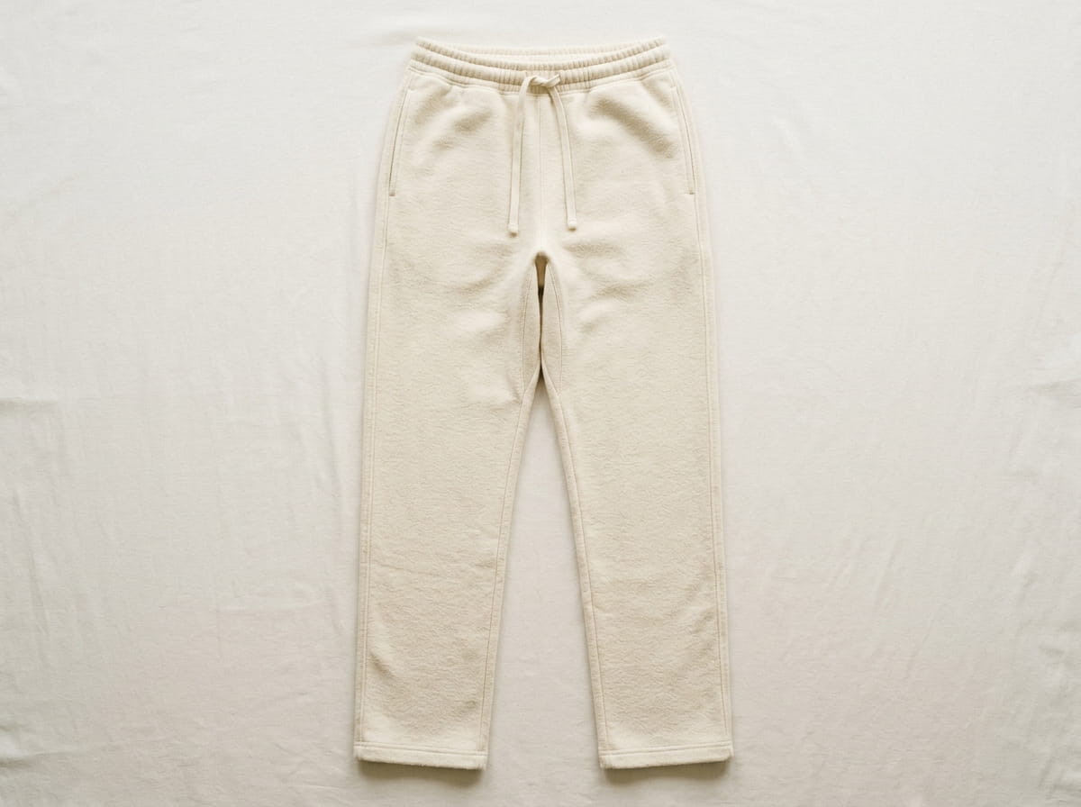 Custom sweatpant anatomy — elasticated drawcord waistband, relaxed straight leg, full-leg side seam, front thigh panel, open-bottom or elastic-cuff hem