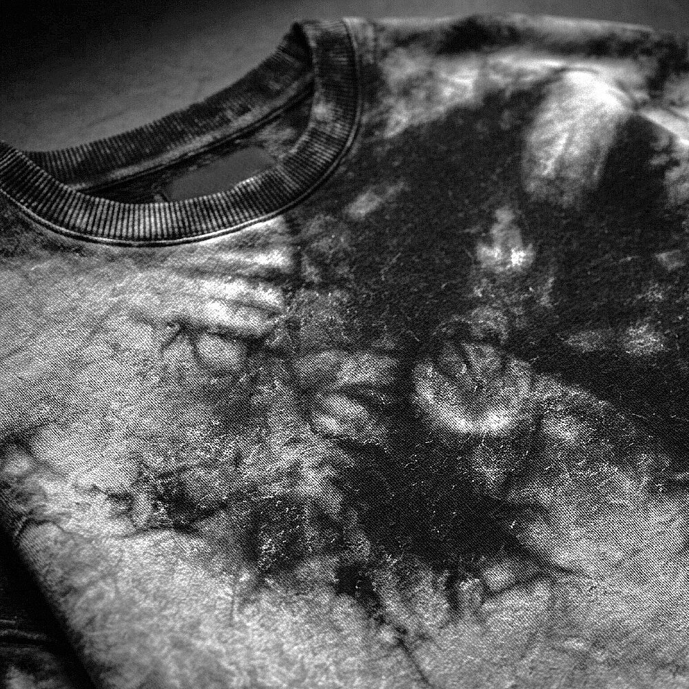 close-up of black and grey tie-dyed sweatshirt fabric