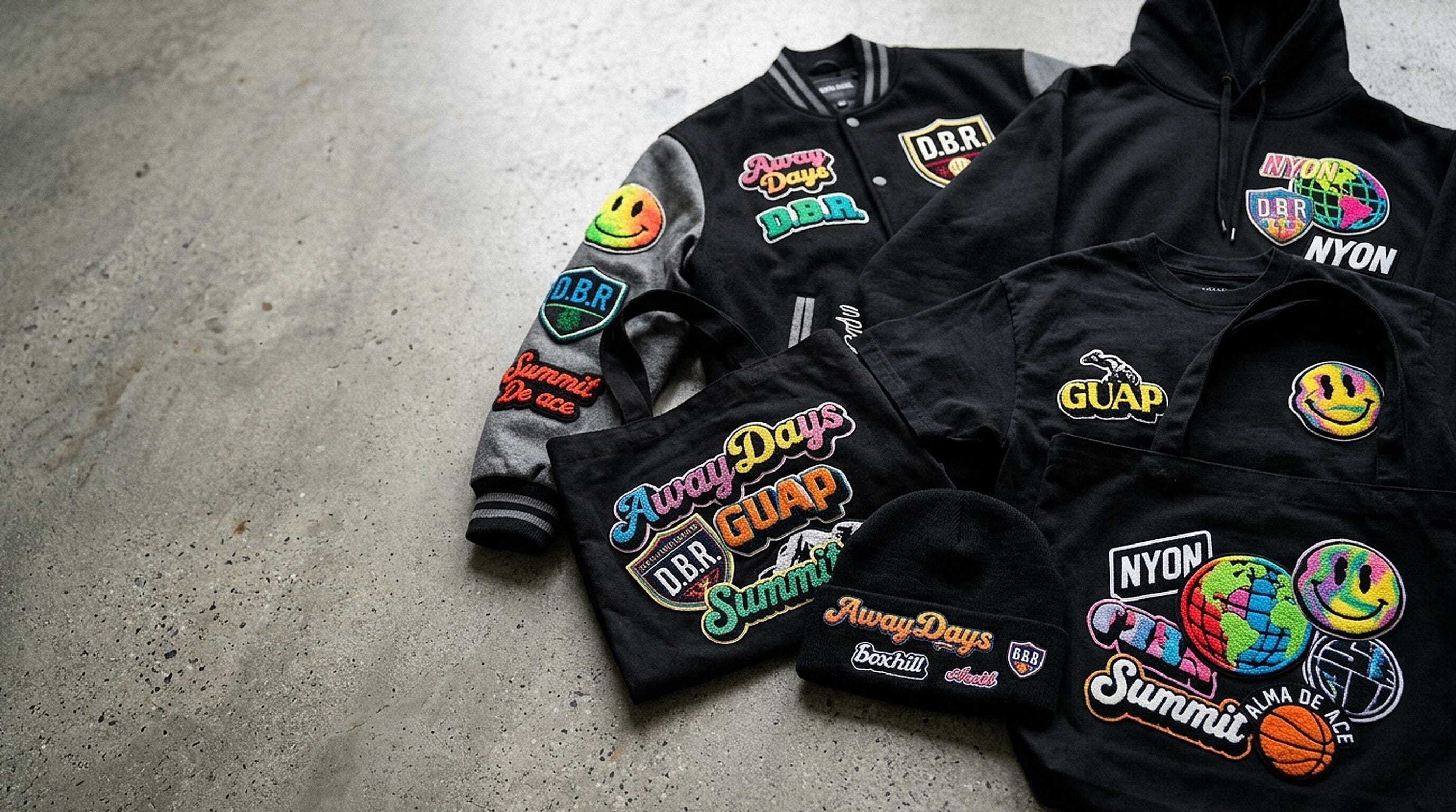 Plush chenille varsity patches on a jacket, hoodie and cap
