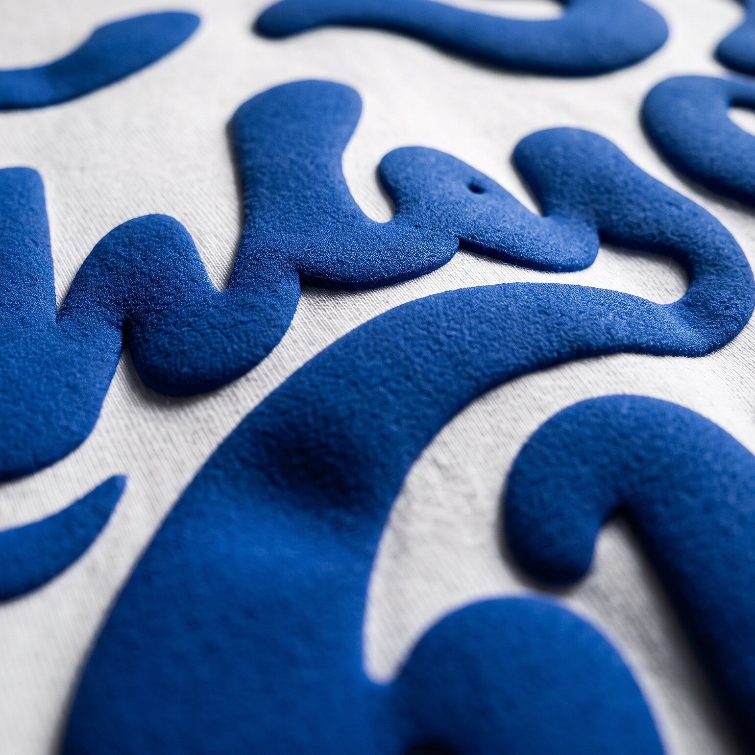 Close-up of a raised 3D puff print