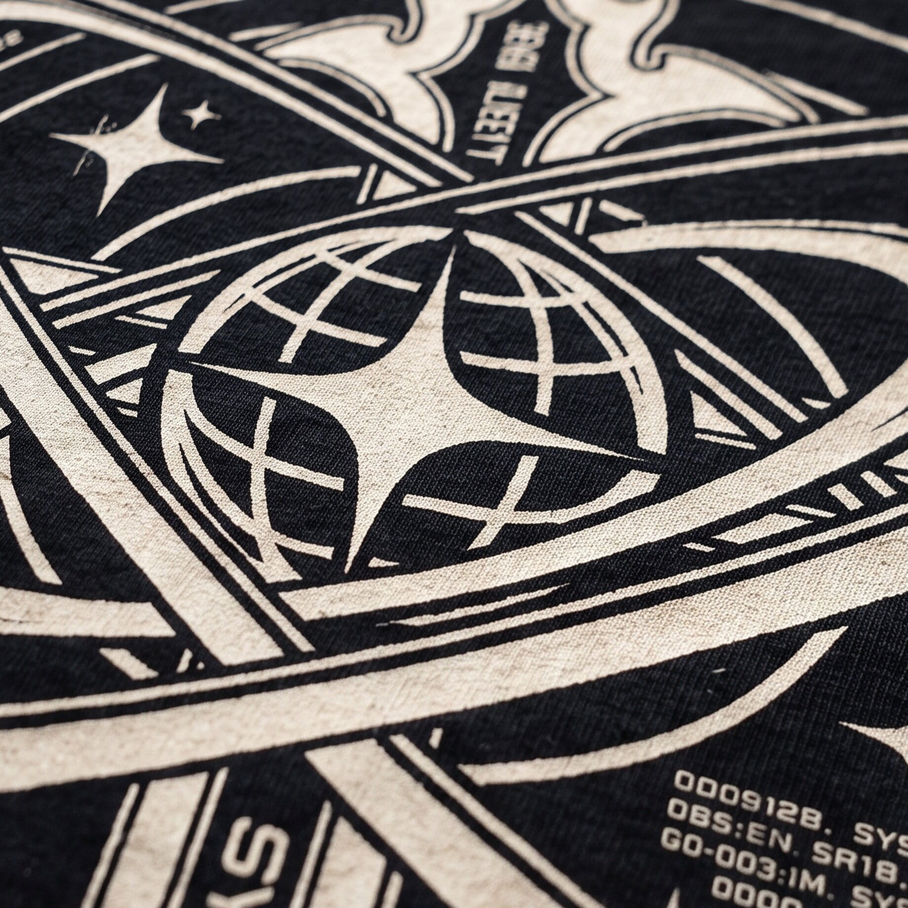 Close-up of a soft discharge print on a dark cotton t-shirt