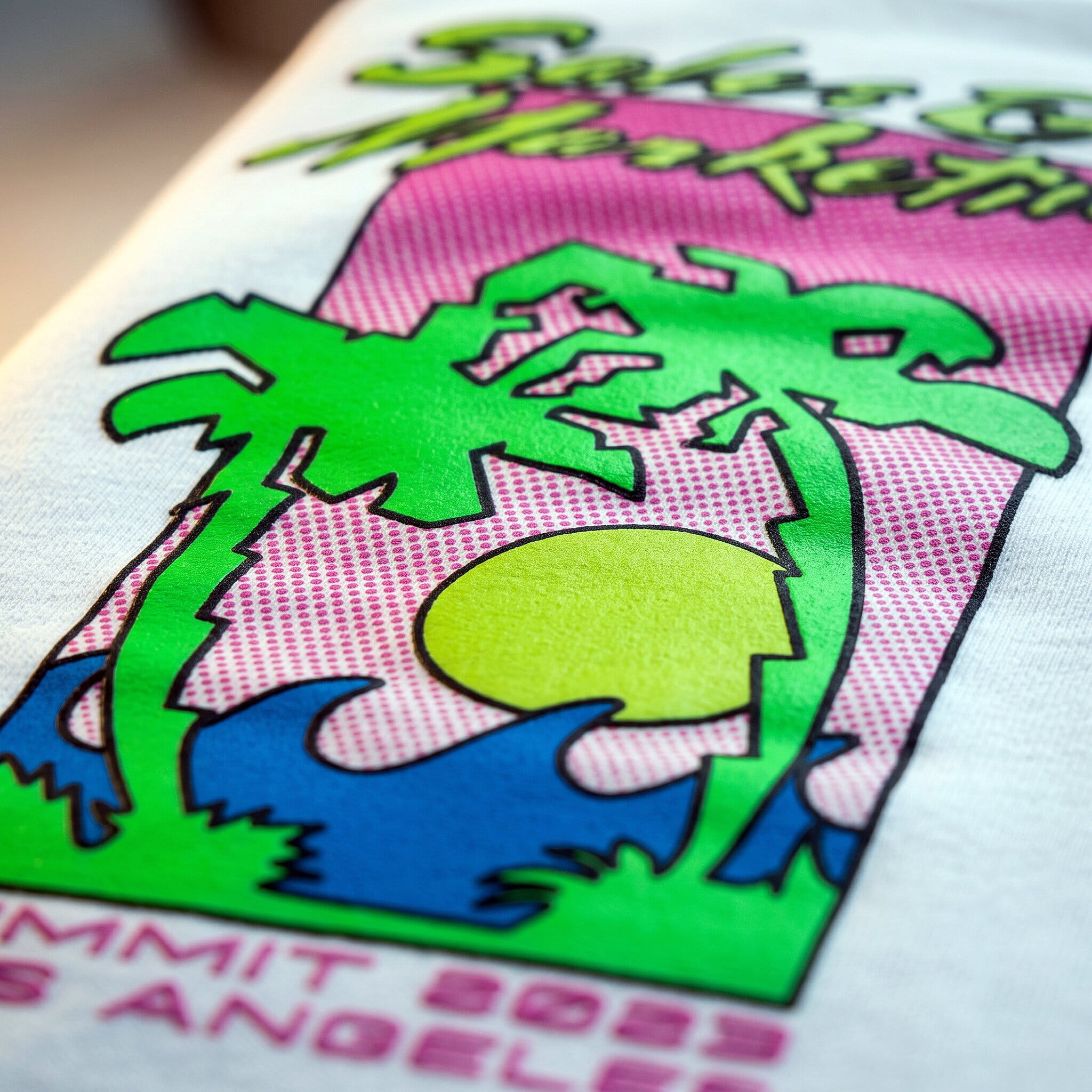 Bold vivid multi-color plastisol screen print on a cotton t-shirt