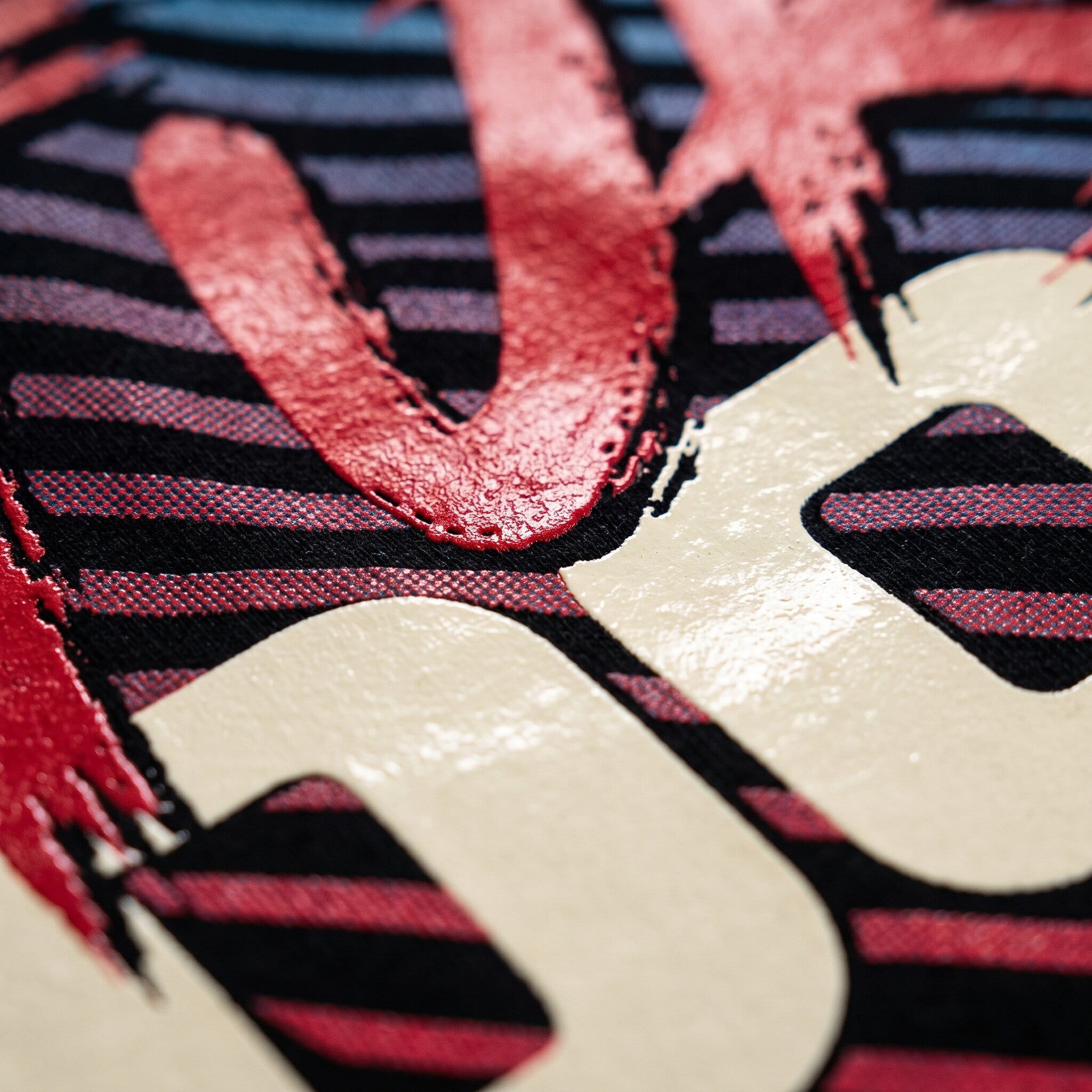 glossy cream and red plastisol print on a striped shirt