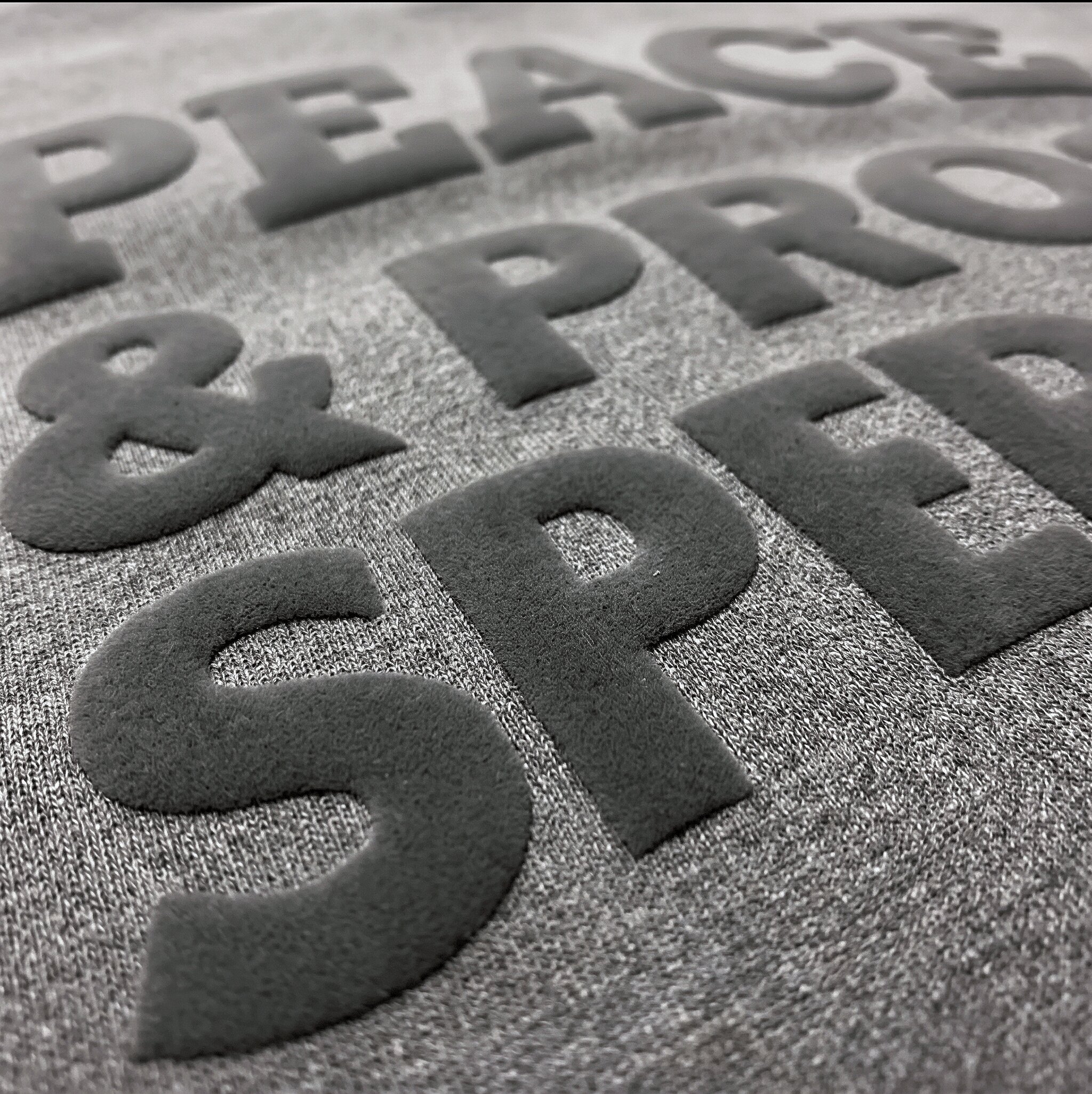 Close-up of a soft raised 3D puff screen print
