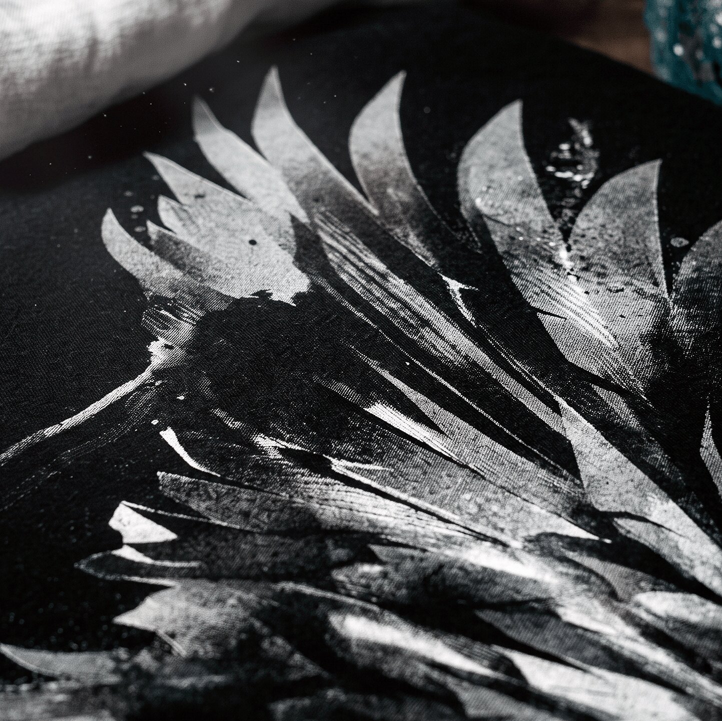Close-up of a soft water-based screen print on a t-shirt
