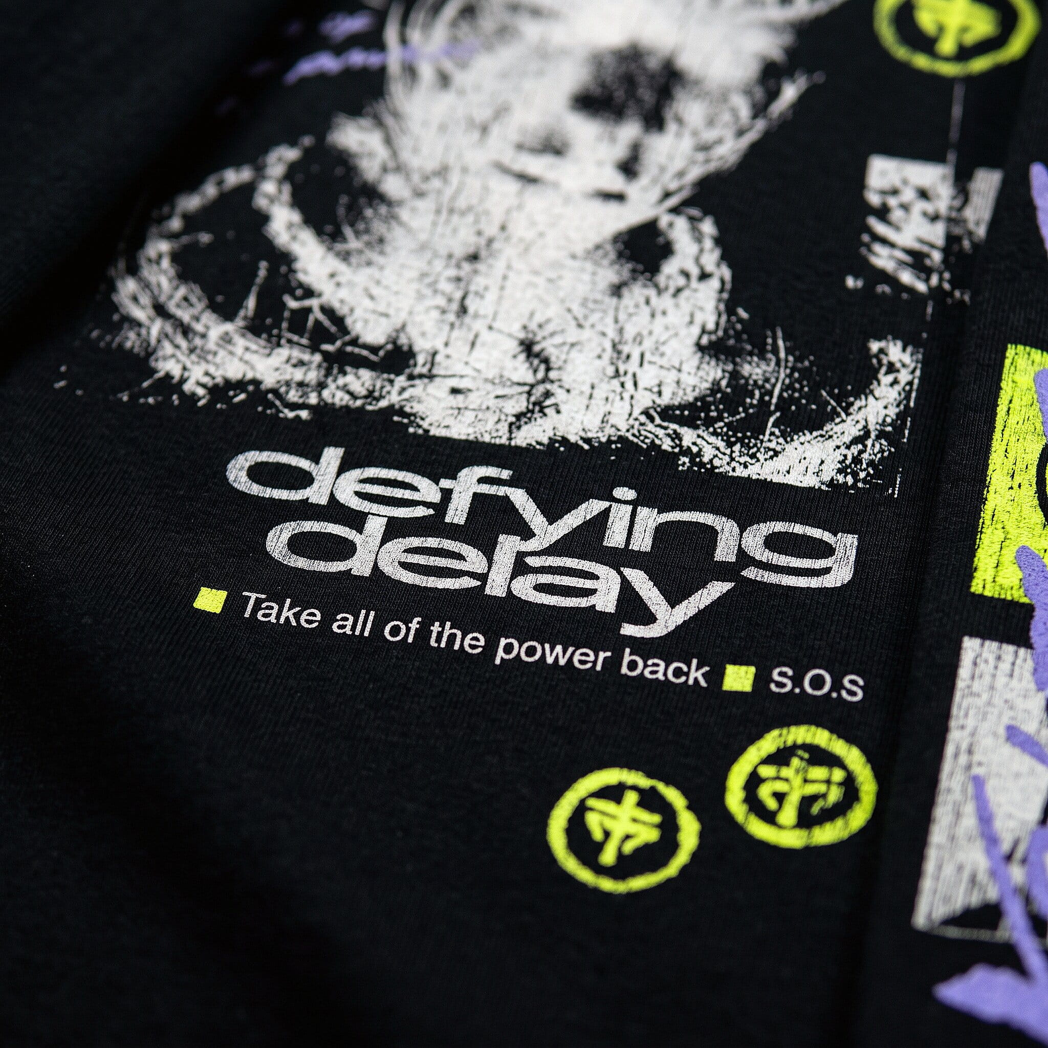 Close-up of a soft discharge print on a dark cotton t-shirt