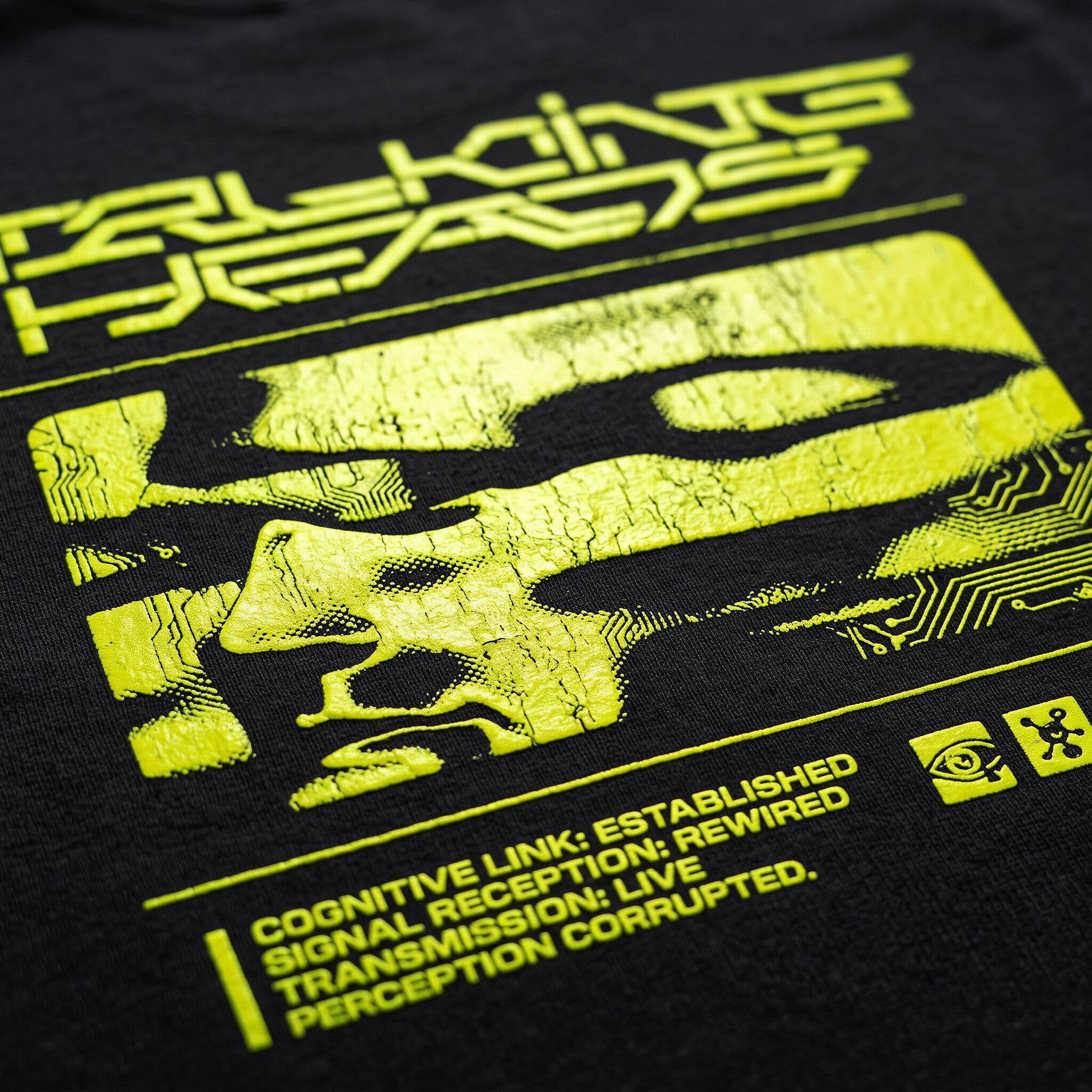 Close-up of a bold opaque plastisol print on a black t-shirt