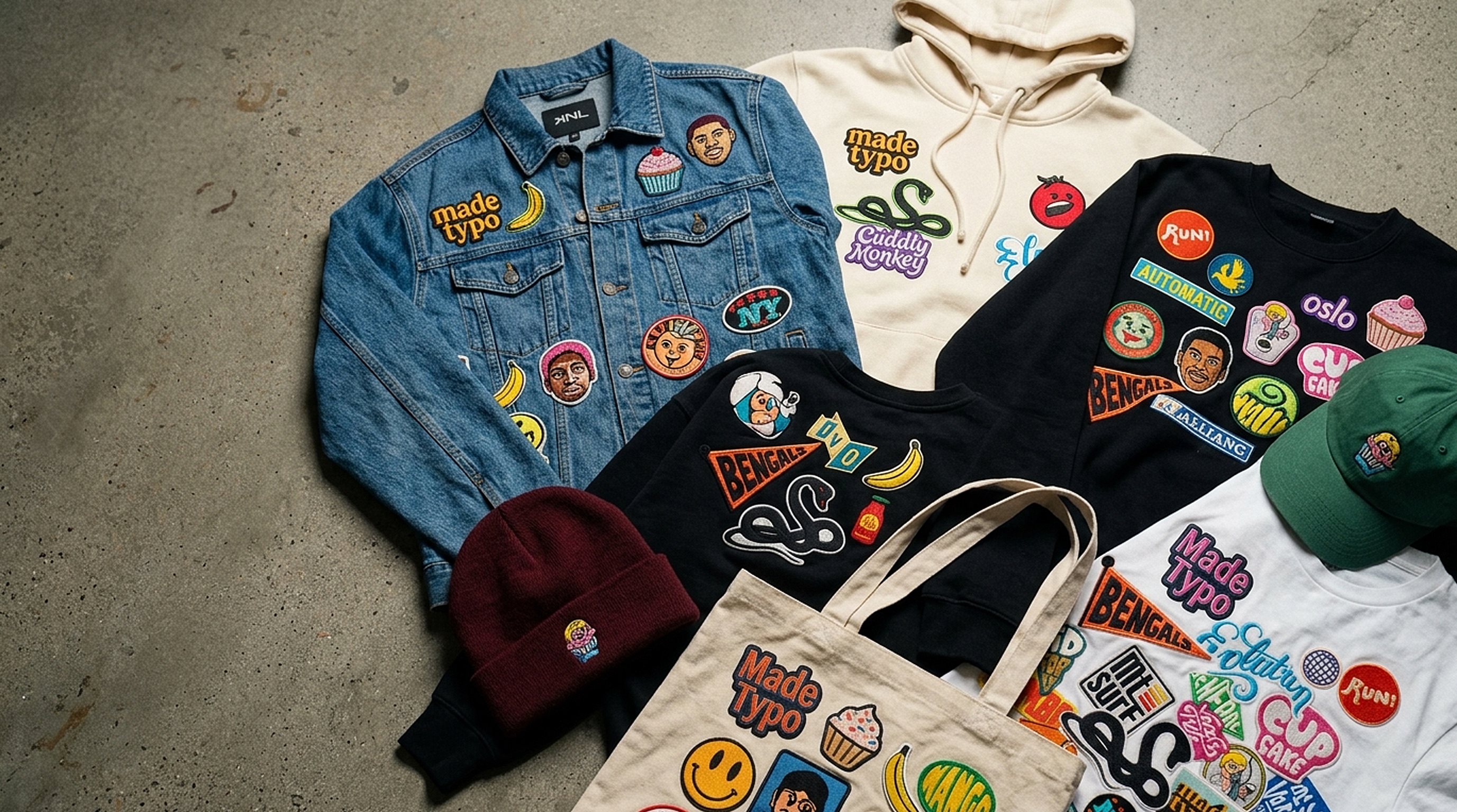 Custom woven and embroidered patches on a jacket, hoodie and cap